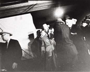 (THE ASSASSINATION OF JOHN F. KENNEDY) A pair of photographs documenting the slaying of Lee Harvey Oswald by Jack Ruby.